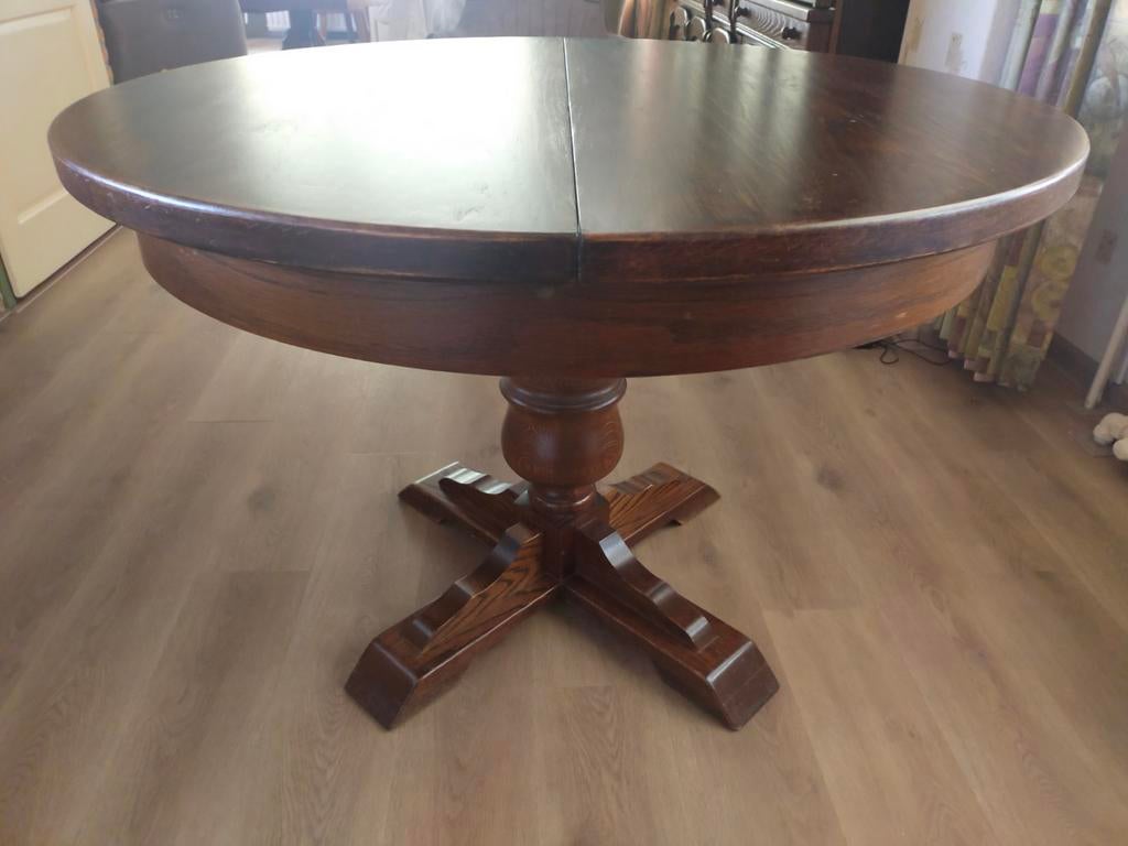 Uitschuifbare ronde eettafel van donker hout, Ophalen