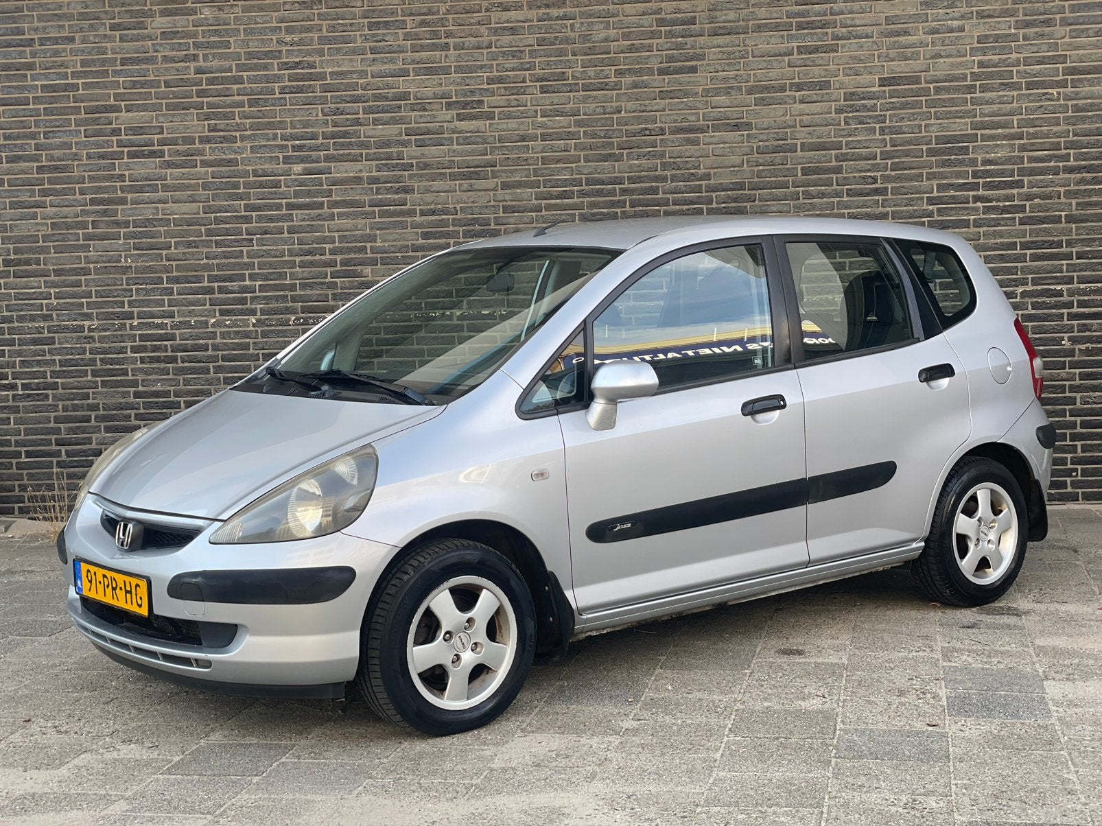 Honda Jazz 1.4 I 2004 Nap 1e eigenaar Automaat Airco, Auto's, 83 pk, 40 €/maand, Zwart, 4 cilinders