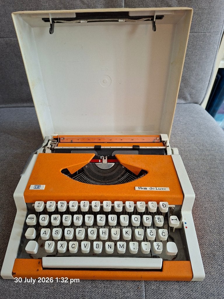 Vintage Oranje Schrijfmachine UNIS TBM de Luxe + Koffer, Diversen, Typemachines, Ophalen, Zo goed als nieuw