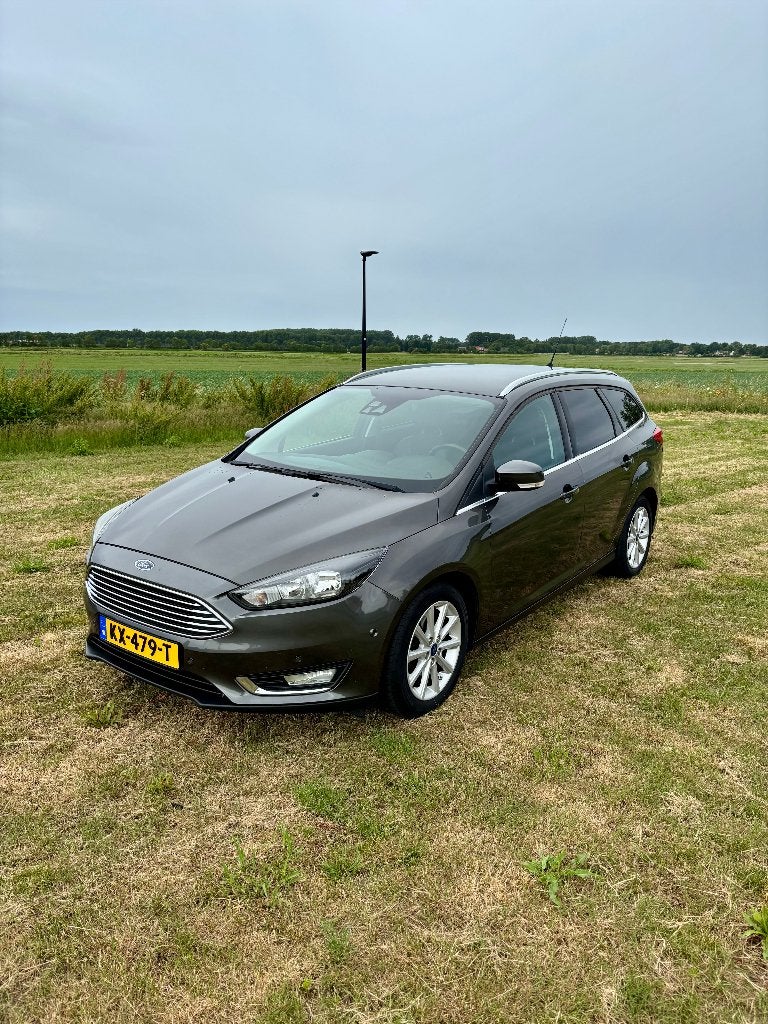 Ford Focus 1.0 Titanium Wagon 125pk (2016), Auto's, 125 pk, Leder en Stof, Navigatiesysteem, Handgeschakeld