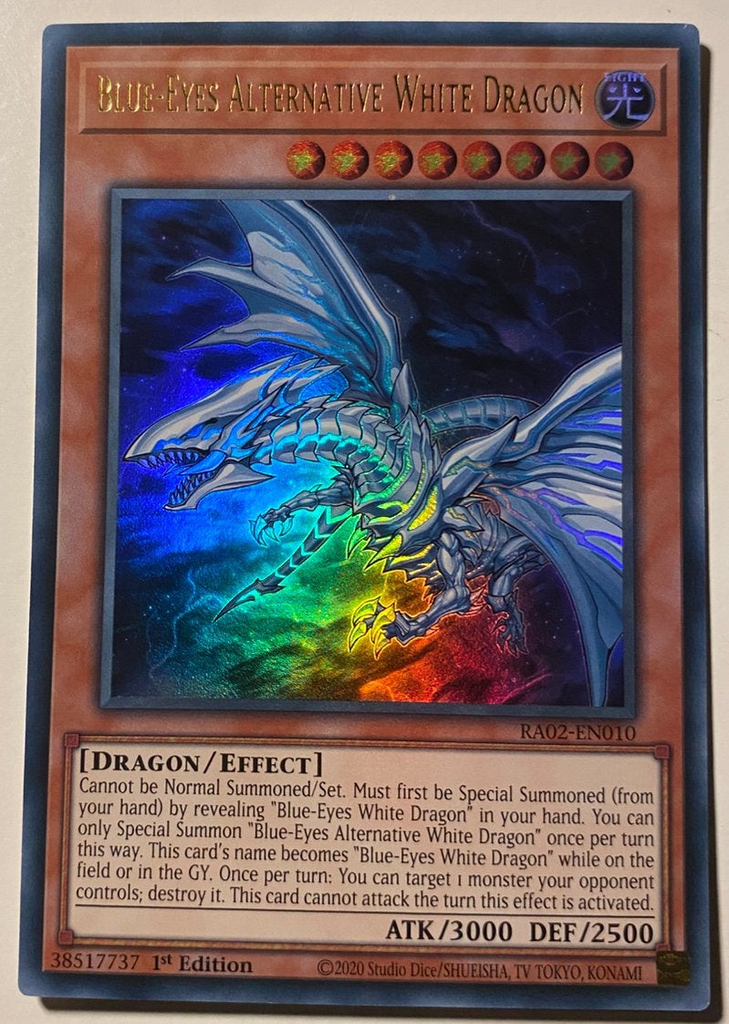 Yu-Gi-Oh! Blue-Eyes Alternative White Dragon RA02 1st !, Ophalen of Verzenden, Zo goed als nieuw, Losse kaart, Foil