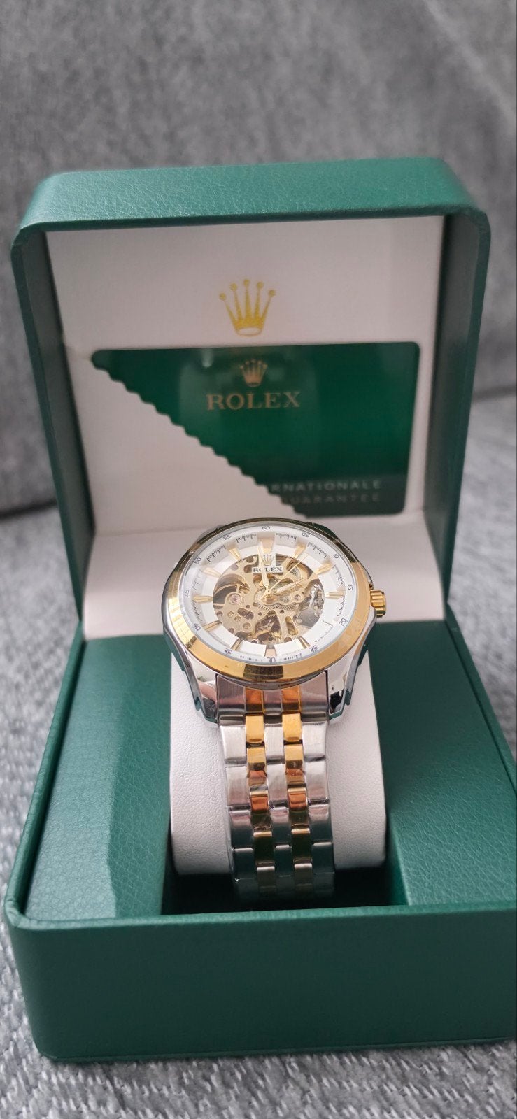 Rolex horloge met open uurwerk en tweekleurige band, Ophalen
