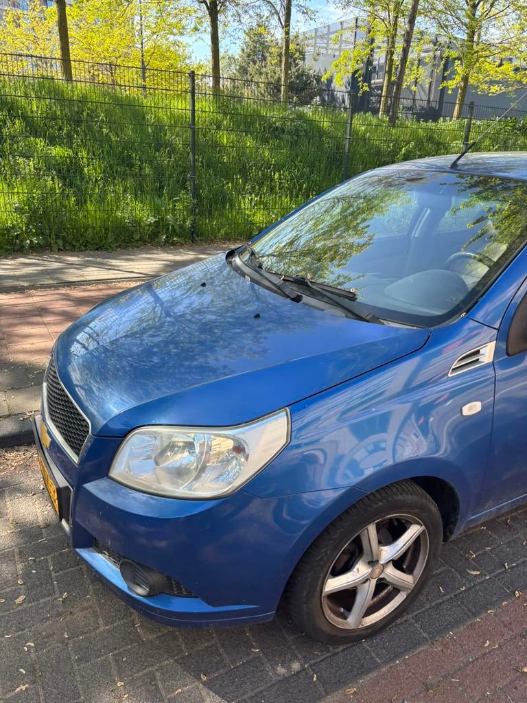 Chevrolet Aveo 1.4 16V 5D AUT 2009 Blauw, Auto's, Stof, 40 €/maand, Aveo, 4 cilinders