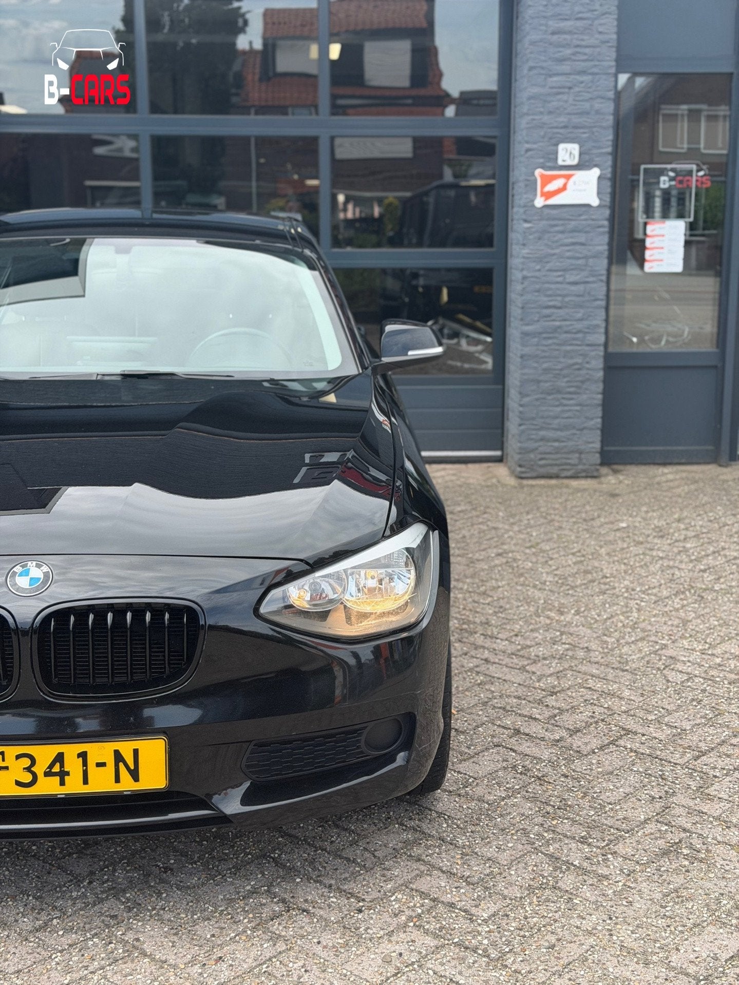 BMW 1-serie 116i Executive Leer|XlNavi|Stoelvw|Pdc|Sport|Nap, Gebruikt, 4 cilinders, Zwart, 650 kg