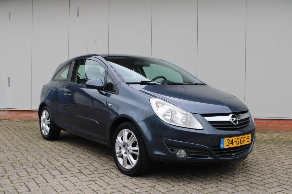 Opel Corsa 1.4-16V Cosmo – 148.651 km – APK 5 augustus 2027, Voorwielaandrijving, 4 cilinders, Blauw, Leder en Stof