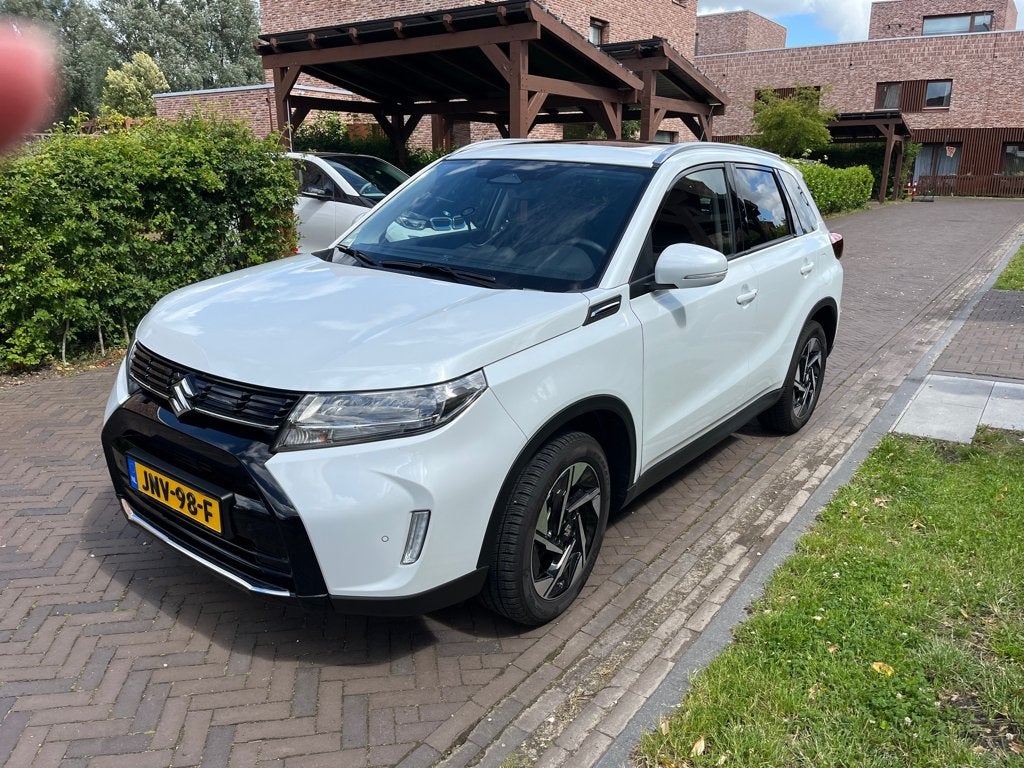 Suzuki Vitara 1.5 l Full Hybrid Automaat, sunroof, 2025 Wit, Auto's, 4 cilinders, 400 kg, Leder en Stof, Wit