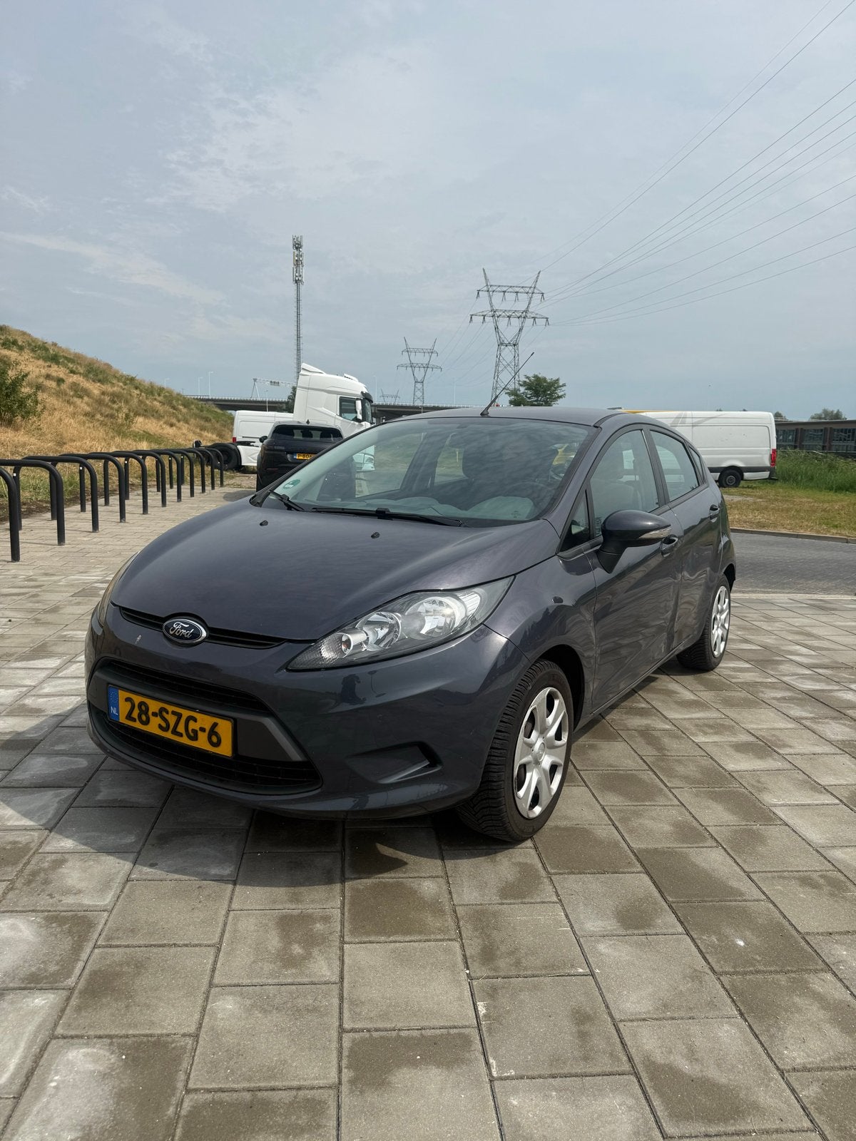 Ford Fiësta 1.25 44KW 5DR 2012 Grijs, Auto's, Ford, Voorwielaandrijving, 40 €/maand, 1242 cc, 4 cilinders