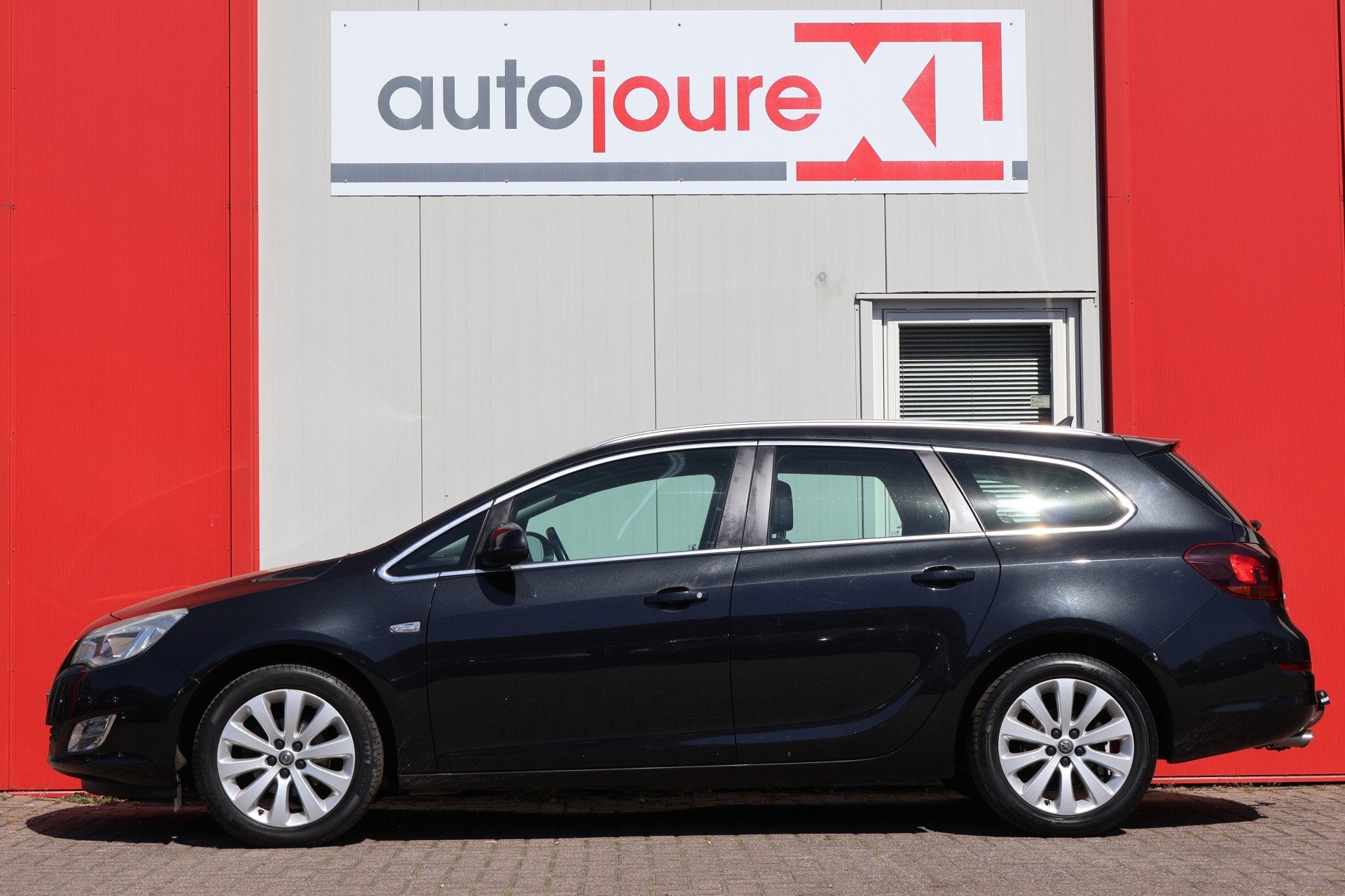 Opel Astra Sports Tourer 1.4 Turbo Cosmo (bj 2012), Auto's, Voorwielaandrijving, Euro 5, Gebruikt, Zwart