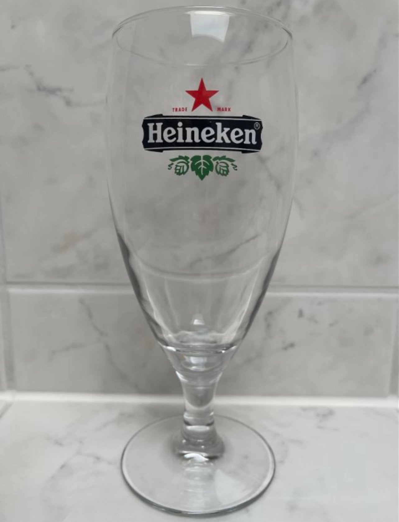 HEINEKEN GLAS - groot voetglas van 40 cl, Ophalen of Verzenden, Zo goed als nieuw, Glas of Glazen, Heineken