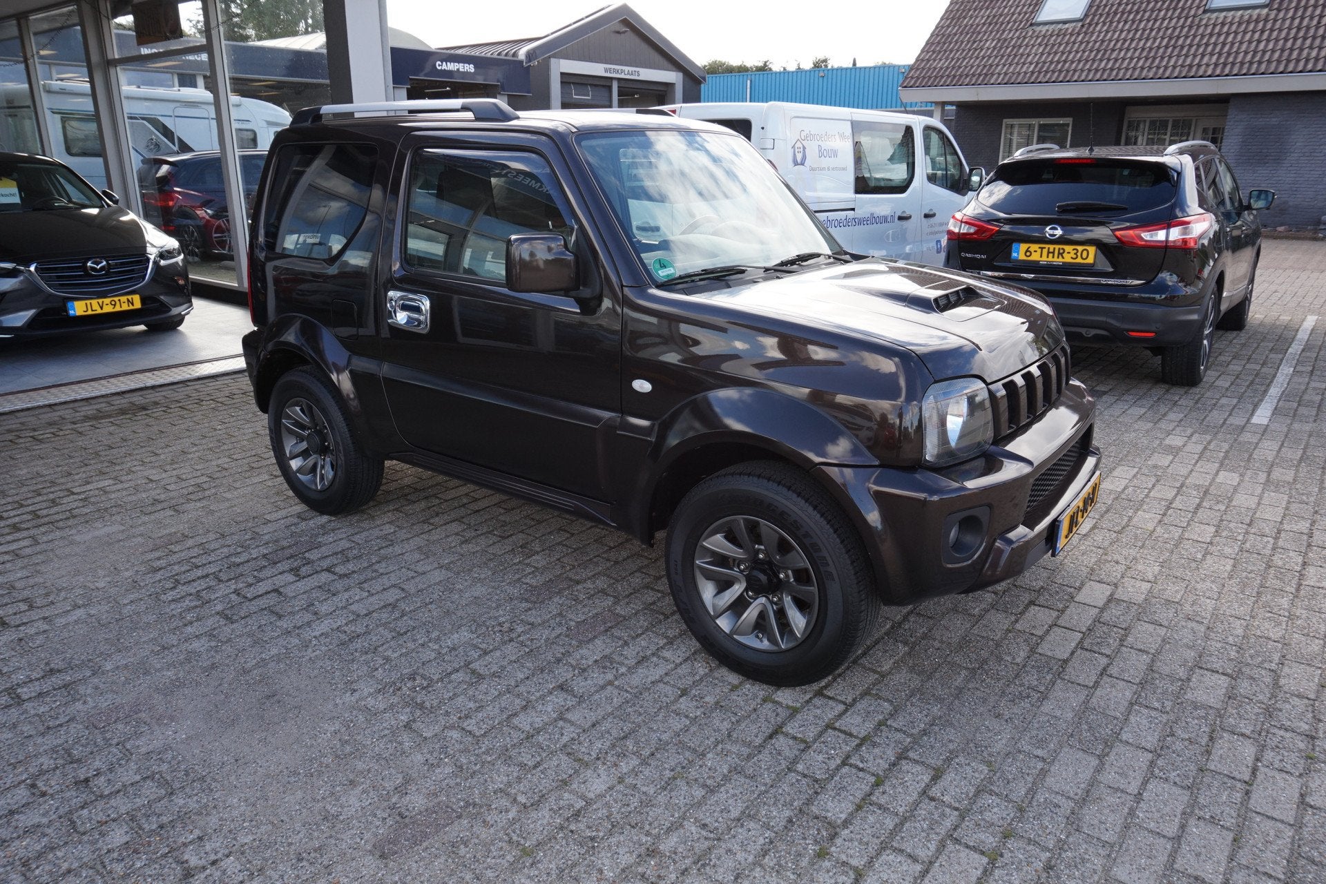 Suzuki Jimny 1.3 Exclusive , 75dkm Incl nw apk/beurt & 12 mn, Auto's, Keurmerk '100% Onderhouden', 86 pk, Gebruikt, Zwart