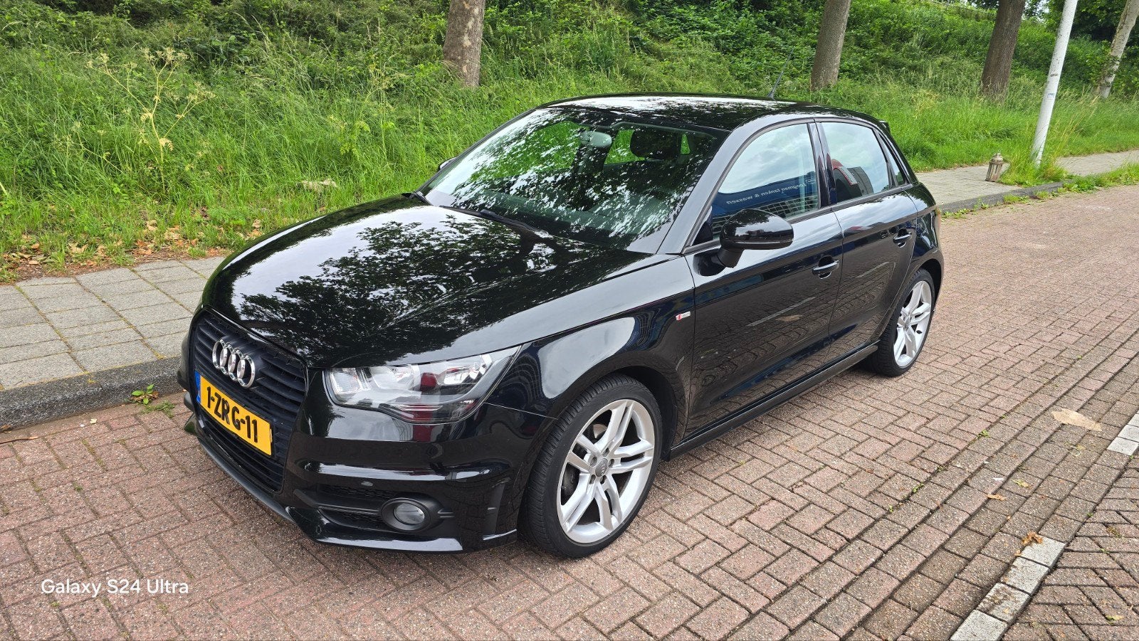 Audi A1 1.2 Tfsi 63KW SB Sline 2015 Zwart, Auto's, Audi, Voorwielaandrijving, Euro 5, 4 cilinders, Leder en Stof