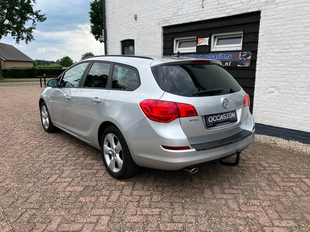 Opel Astra Sports Tourer 1.4 Turbo 1E EIG 120PK TREKHAAK CRU, Auto's, Voorwielaandrijving, Stof, Gebruikt, Zwart