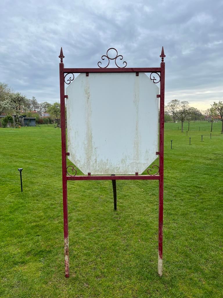 Smeedijzeren uithangbord - reclamebord, Ophalen