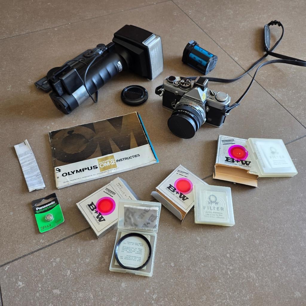 Antieke Olympus OM-2 met flitser, extras en polarisatielens, Ophalen of Verzenden, Gebruikt, Spiegelreflex, Olympus