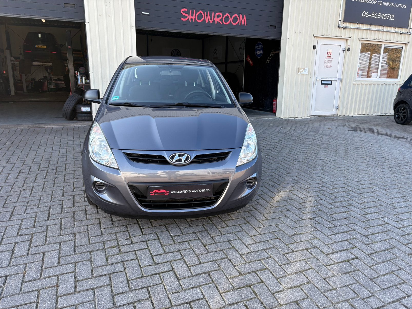 Hyundai i20 1.2 i-Motion 2011 5 deurs Airco, Auto's, Voorwielaandrijving, Euro 5, Stof, Zwart
