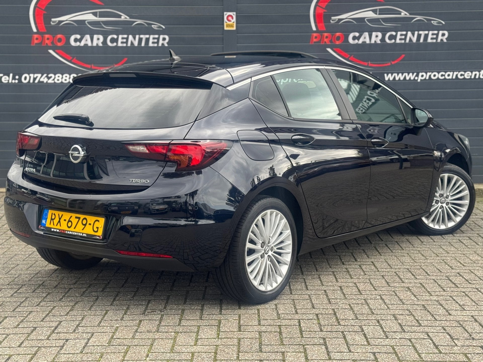 Opel Astra 1.4 Business+ Aut | Dak | Cruise | Climate | Stoe, Auto's, Gebruikt, Euro 6, 150 pk, Blauw