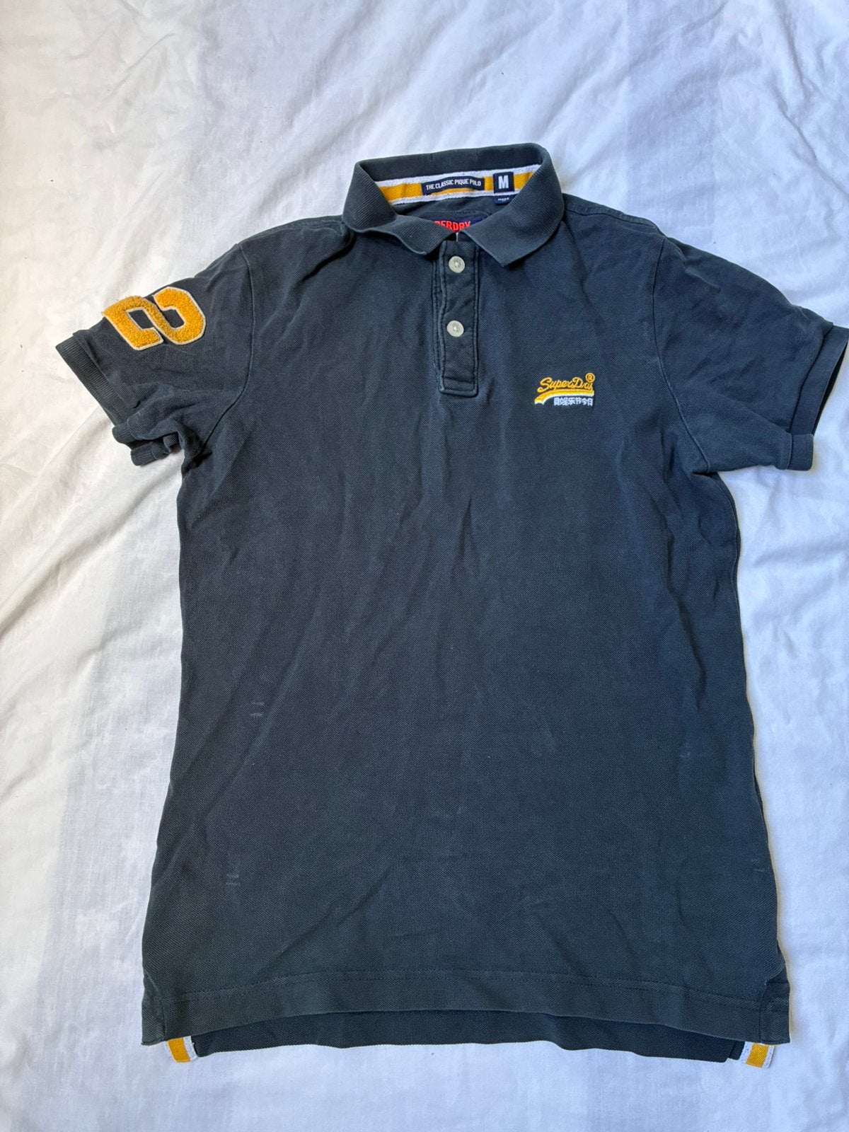 Superdry polo, Ophalen of Verzenden, Gedragen, Maat 48/50 (M), Meerkleurig