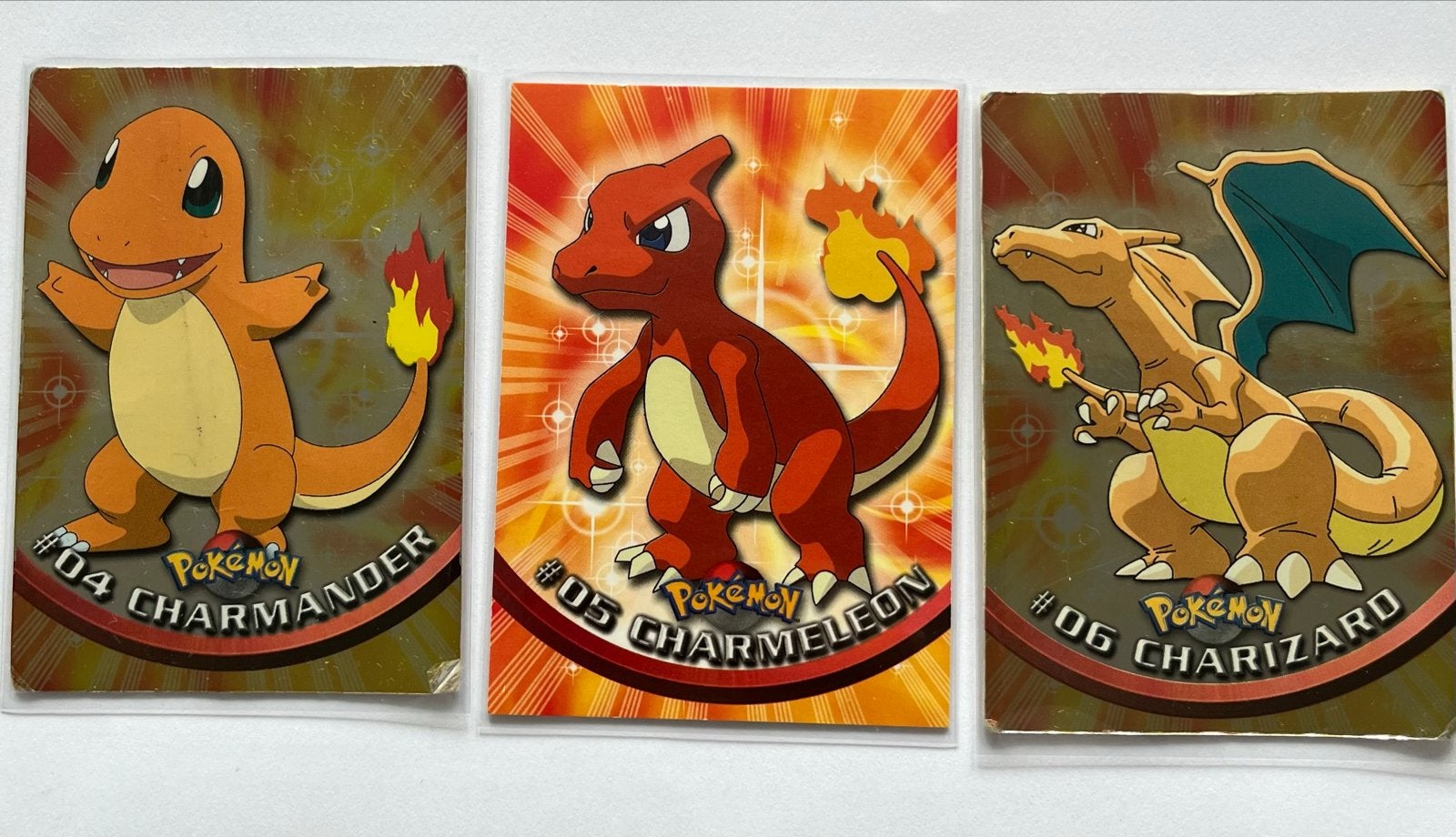Topps Charmander, Charmeleon en Charizard, Ophalen of Verzenden, Gebruikt, Meerdere kaarten