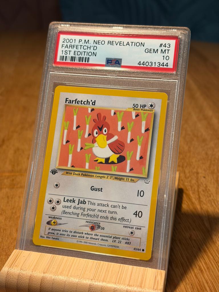 Farfetch’d 1st editon PSA 10 Neo Revelation LOW POP, Ophalen of Verzenden, Zo goed als nieuw