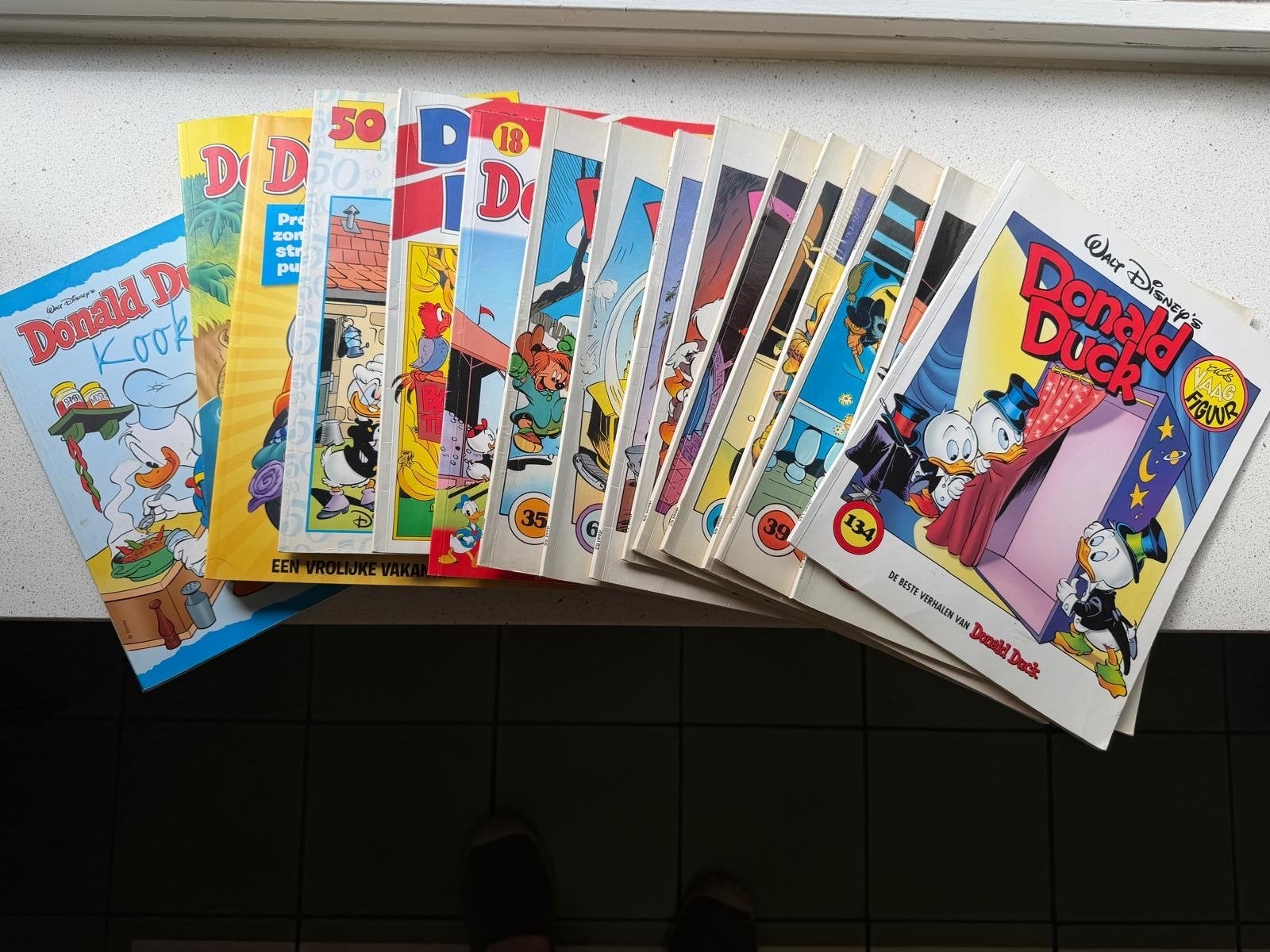 15 Donald Duck stripboeken + Donald Duck kookboek, Boeken, Meerdere stripboeken, Ophalen, Gelezen