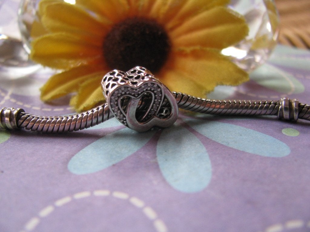 Pandora bedel 791880CZ = entwined hearts + zirkoniaas, Pandora, Ophalen of Verzenden, Zo goed als nieuw, 1 bedel