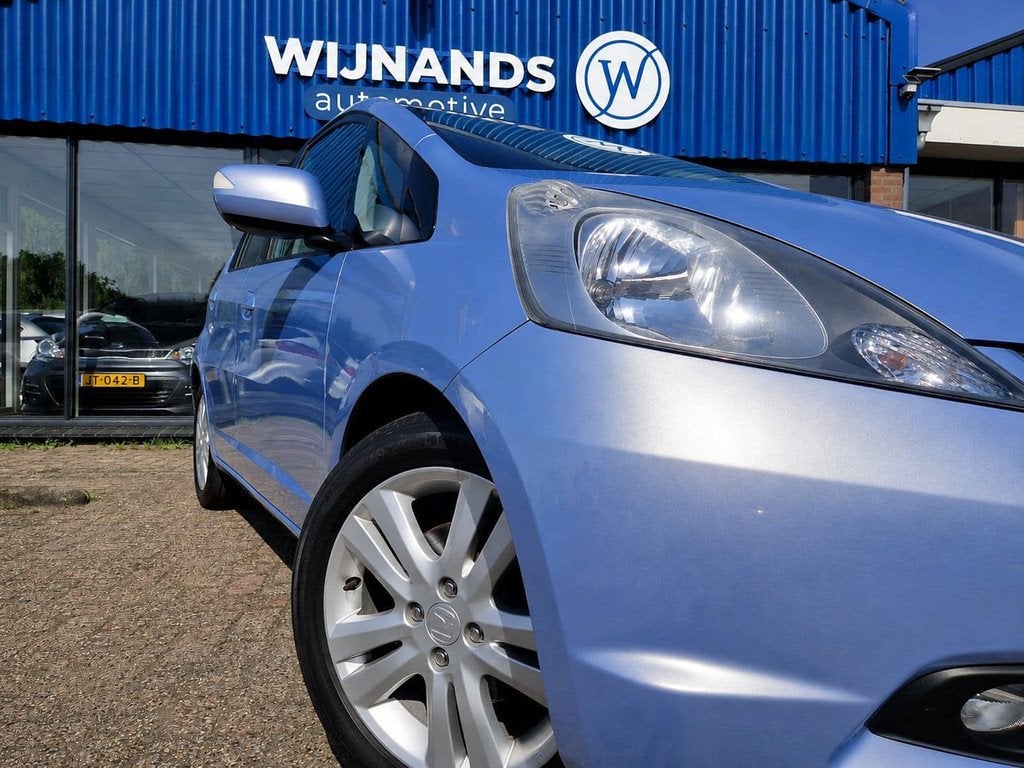 Honda Jazz 1.4 Exclusive Automaat Clima Stoelvw Cruise Bluet, Auto's, Honda, Euro 5, 450 kg, 40 €/maand, 4 cilinders