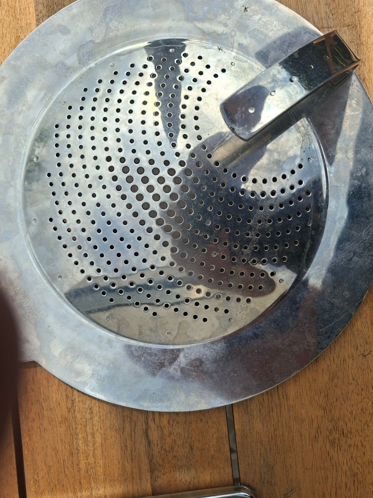 Spatdeksel Fissler, Ophalen
