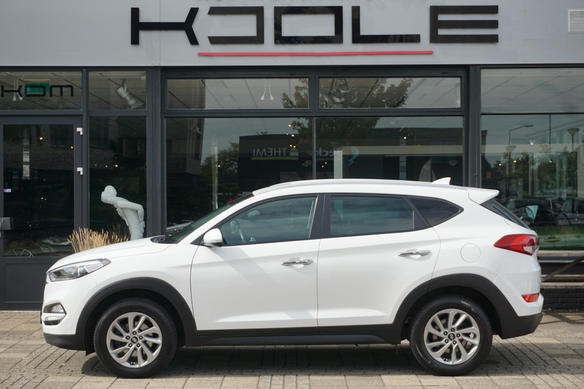 Hyundai Tucson 1.6 GDi Premium | Leder | Camera, Auto's, Voorwielaandrijving, Gebruikt, 4 cilinders, Met garantie (alle)