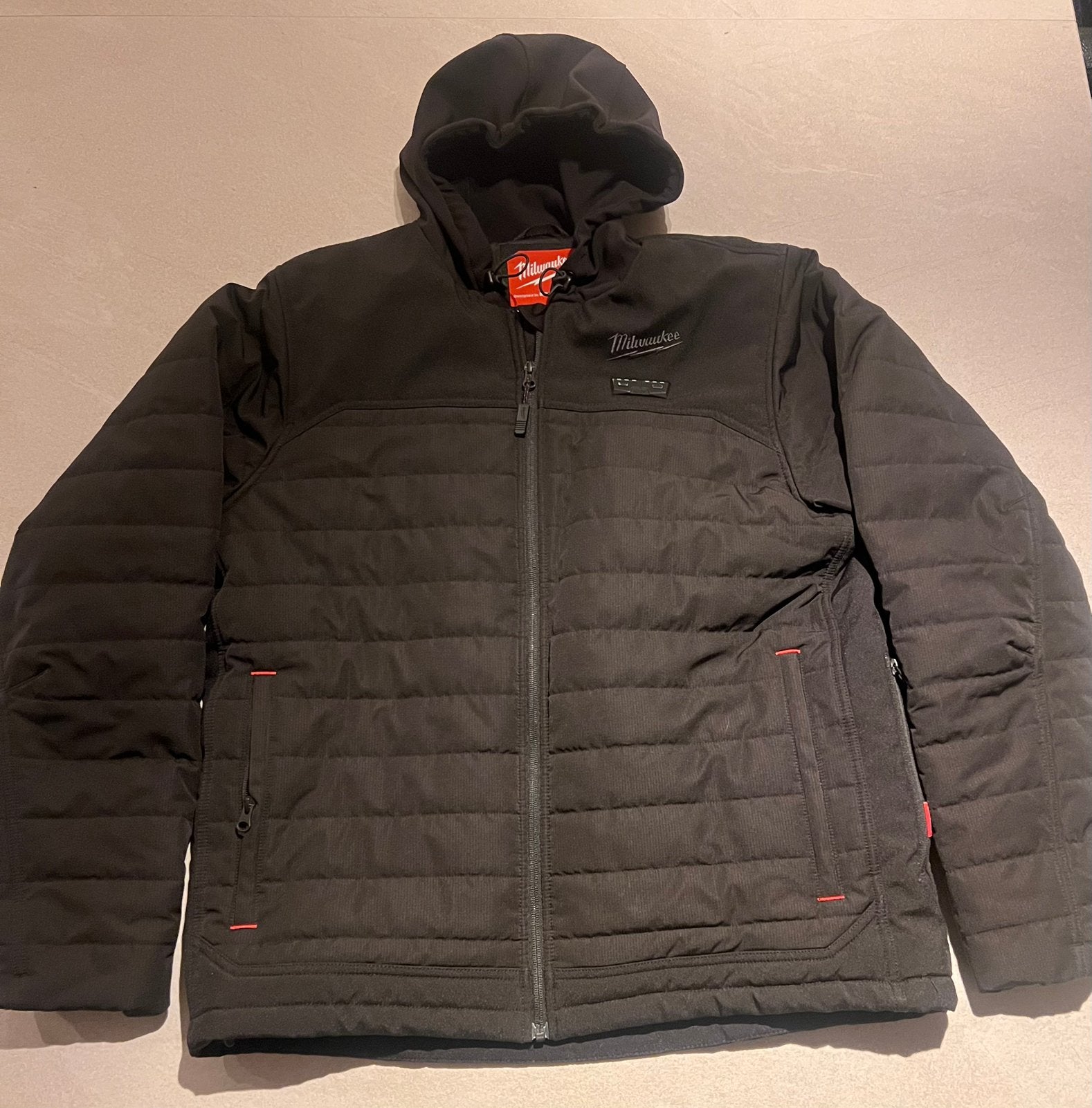 Milwaukee jas verwarmd zwart. puffer M12 HPJBL3-0 LARGE, Ophalen, Zo goed als nieuw, Maat 52/54 (L), Zwart