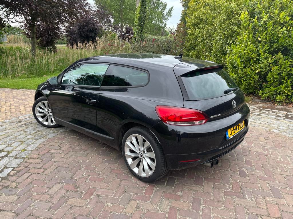 Volkswagen Scirocco 2.0 TSI highline DSG 2009 Zwart, Auto's, Zwart, 4 cilinders, 4 stoelen, Zwart