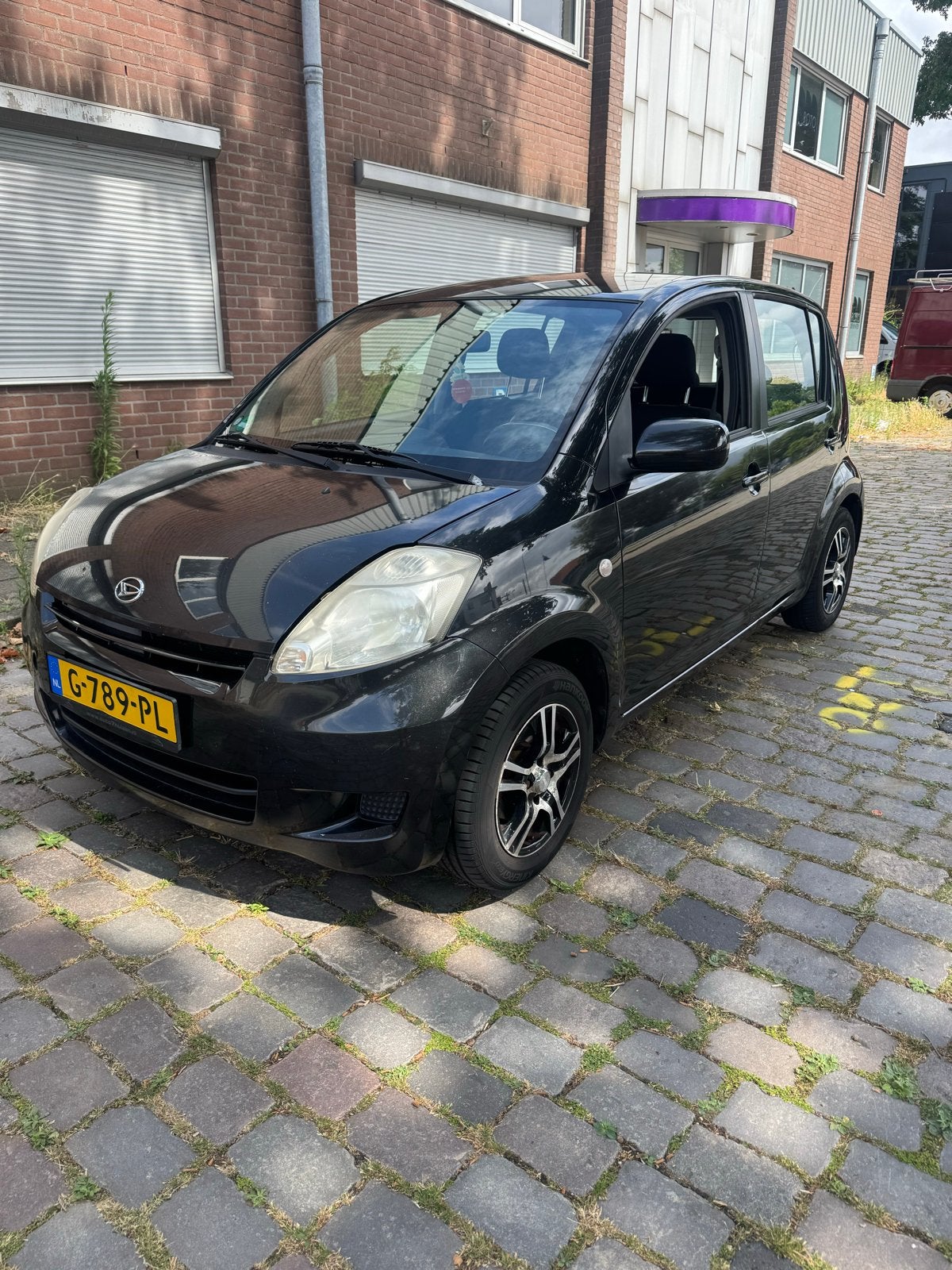 Daihatsu Sirion 1.0 51KW 2008 Zwart, Auto's, Voorwielaandrijving, 4 cilinders, Zwart, Sirion