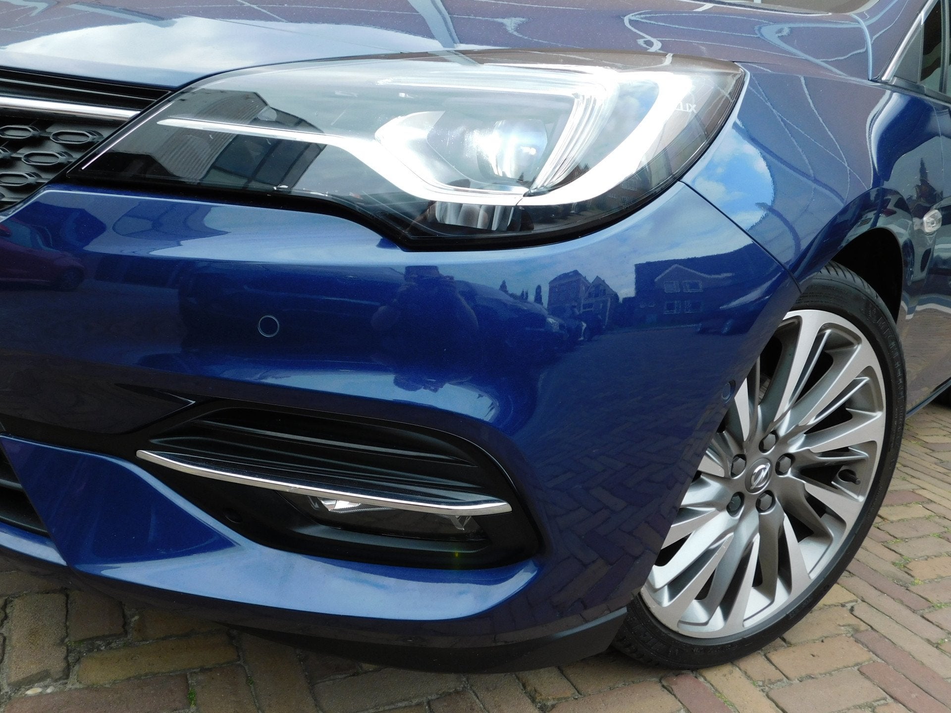 Opel Astra Sports Tourer 1.4 Elegance Automaat (bj 2020), Auto's, Opel, Stof, Gebruikt, Blauw, Origineel Nederlands