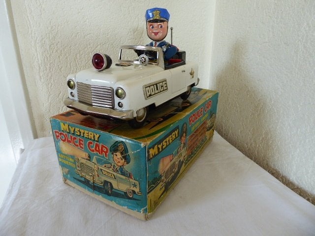 Blikken Nomura Mystery Police Car in de Originele doos Japan, Ophalen of Verzenden