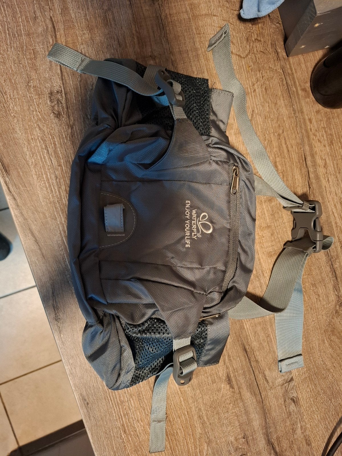 Waterfly heuptas/schoudertas - Grijs, Sport en Fitness, Bergsport en Wandelen, Ophalen, Gebruikt, Rugzak