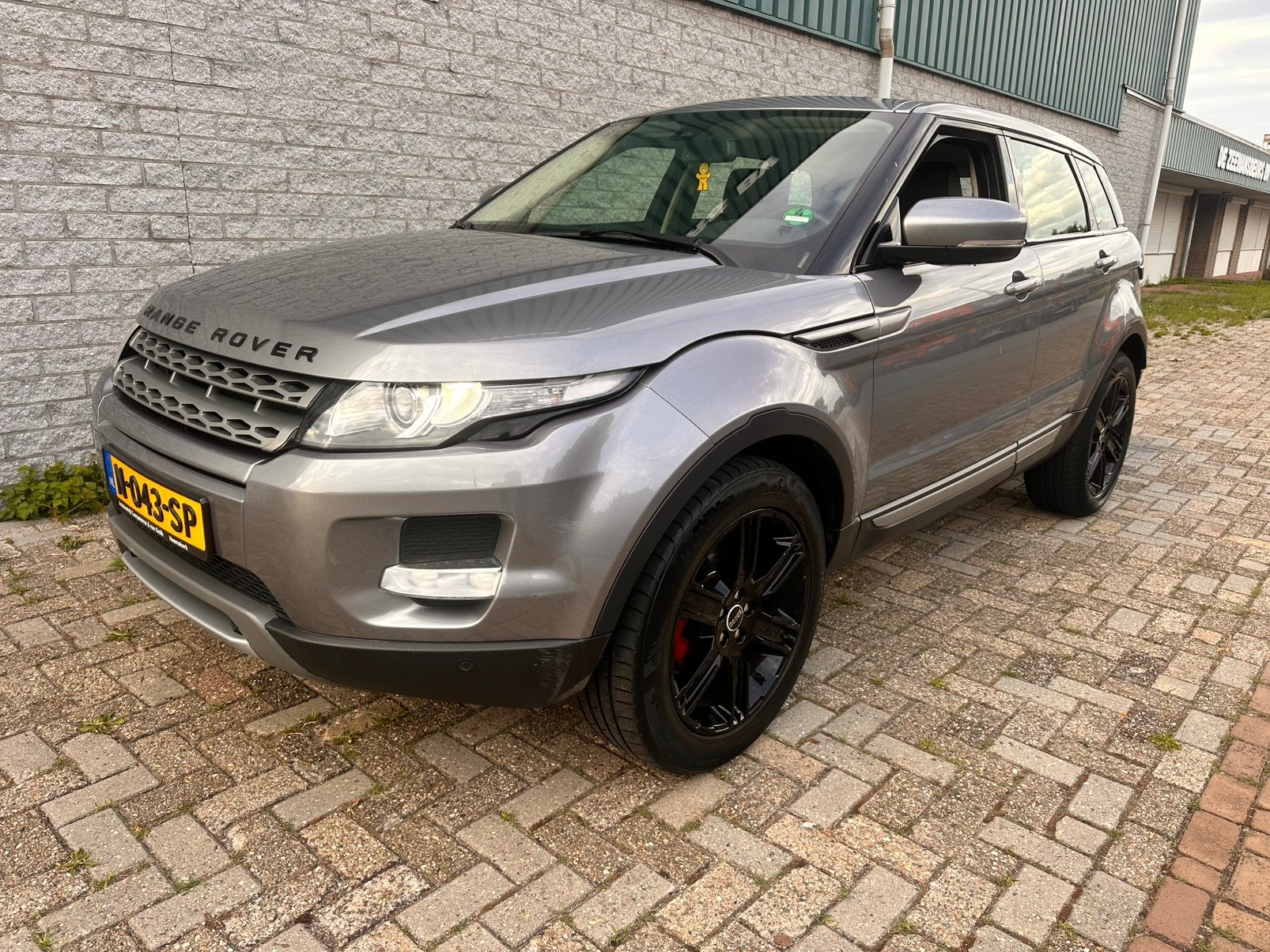 Range rover evoque 2.0 Si4 4WD, Auto's, Automaat, 1800 kg, Zwart, Bi-Xenon koplampen