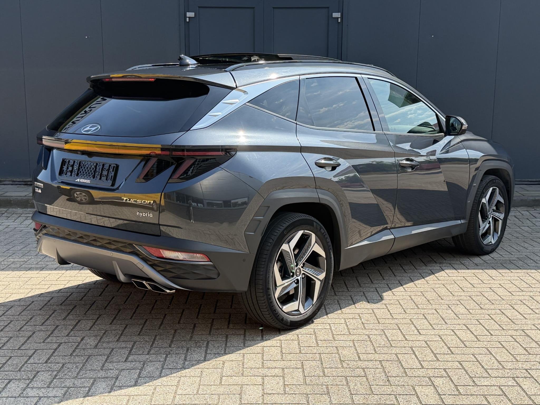 Hyundai Tucson 1.6 T-GDI HEV 230pk Premium Sky / Schuif Kant, Auto's, Gebruikt, Euro 6, 4 cilinders, 1650 kg