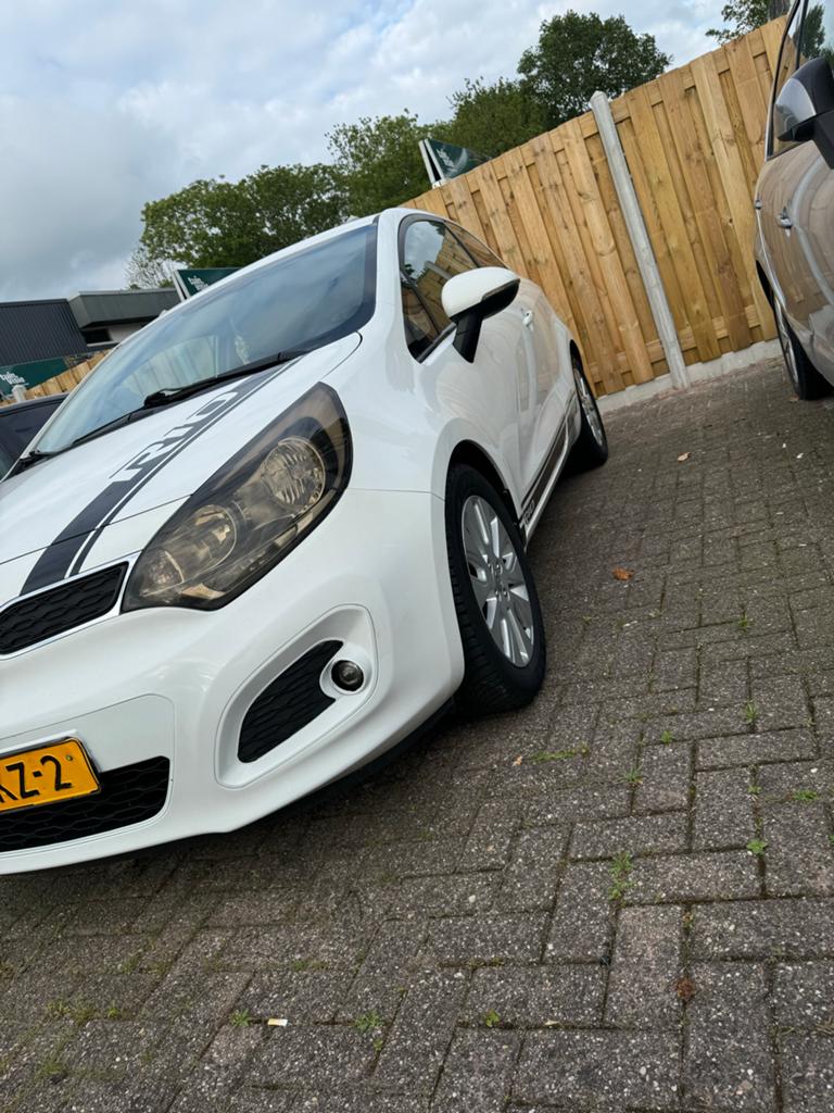Kia Rio 1.2 I 3DRS 2013 Wit, Auto's, Kia, Particulier, Rio, ABS, Airbags, Alarm, Android Auto, Bluetooth, Cruise Control, Elektrische buitenspiegels