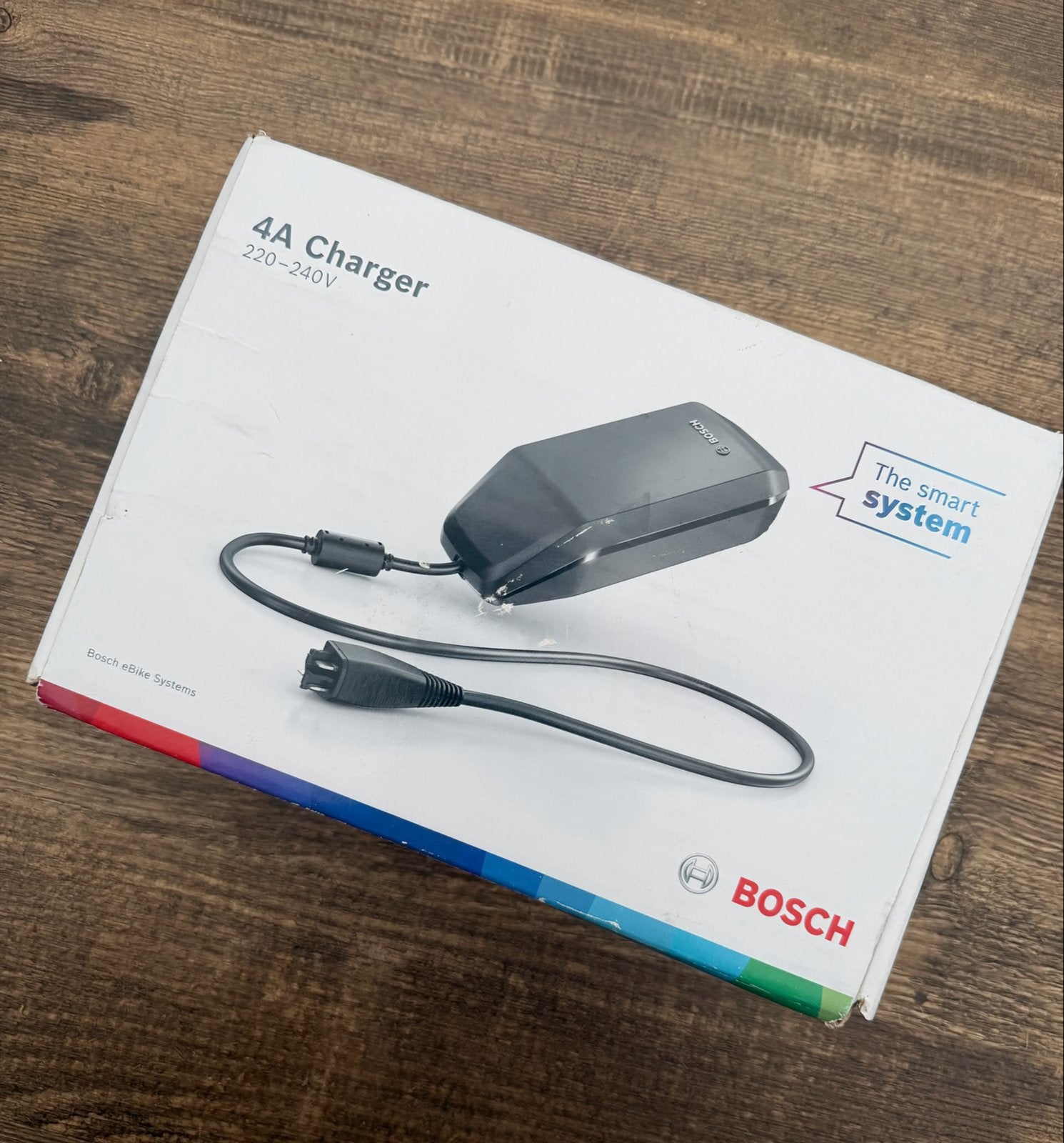 Bosch eBike 4A Oplader BPC3400 - Nieuw in doos, Fietsen en Brommers, Fietsaccessoires | Fietsaccu's, Ophalen of Verzenden, Nieuw