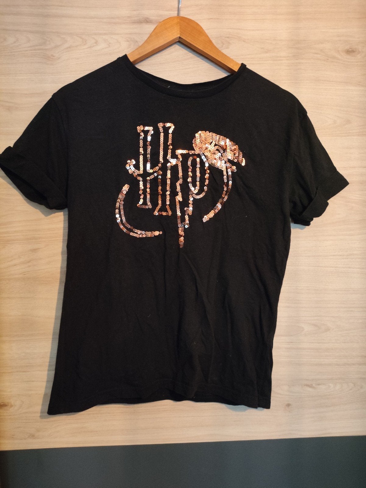 Leuk zwart T-shirt van Harry Potter met pailletten logo., Maat 38/40 (M), Zwart, Ophalen of Verzenden, Zo goed als nieuw