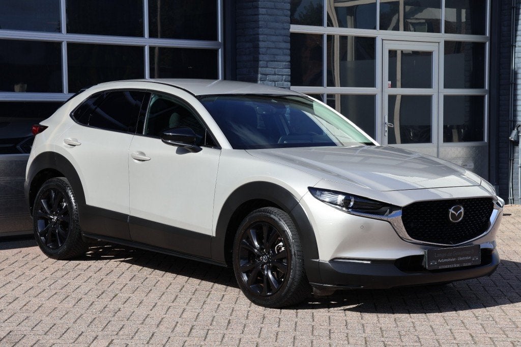 Mazda CX-30 2.0 e- skyactiv X-M Hybrid Homura automaat 186 p, Auto's, 1998 cc, Gebruikt, Met garantie (alle), Beige