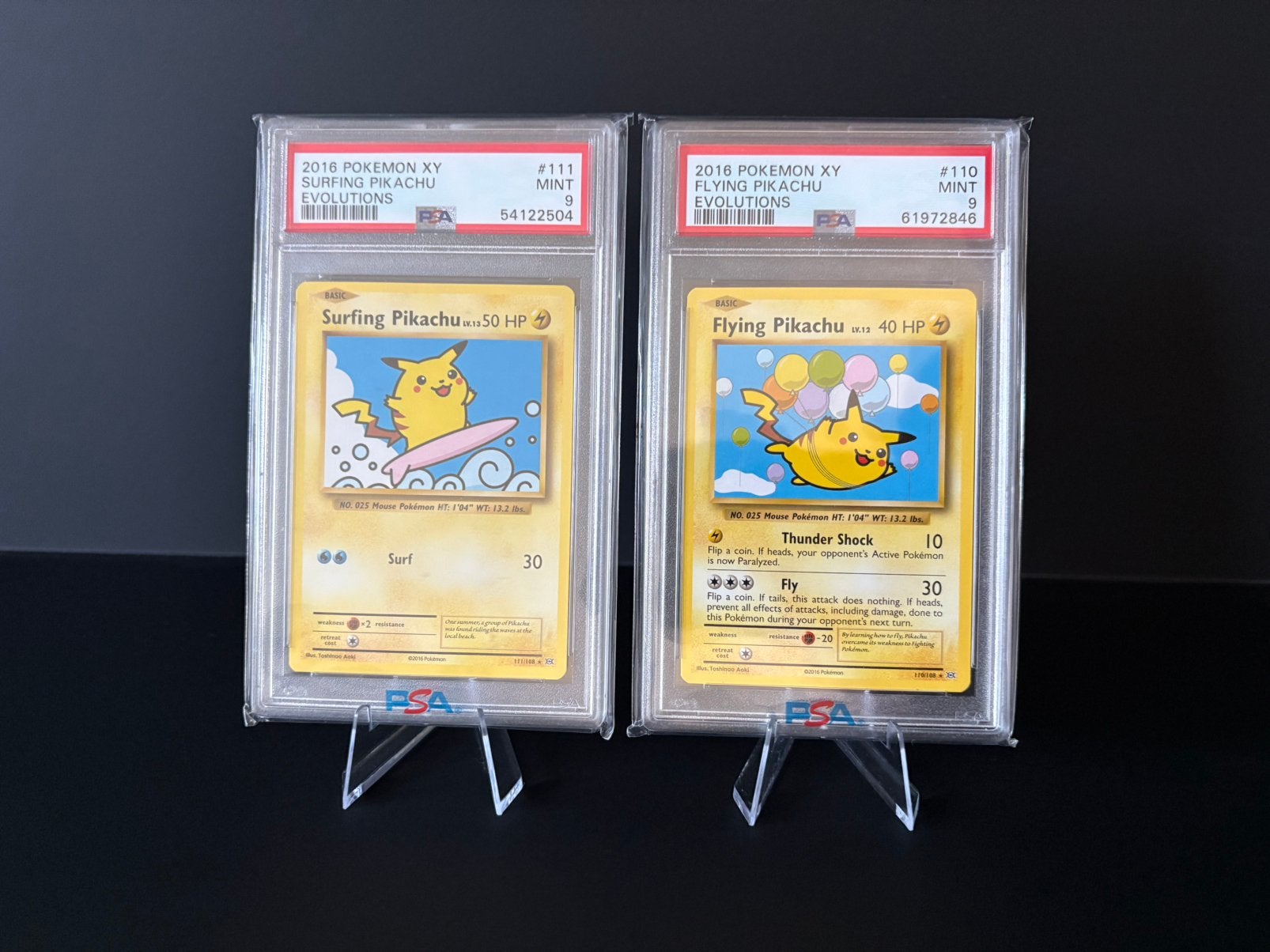 Pokemon - surfing & flying Pikachu psa 9, Ophalen of Verzenden, Zo goed als nieuw