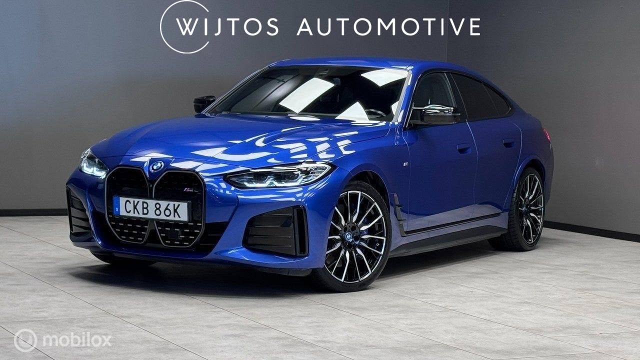 BMW i4 M50 84 kWh. H/K, 20 inch, trekhaak, 360 cam., Auto's, Dealer onderhouden, Gebruikt, 520 km, Blauw