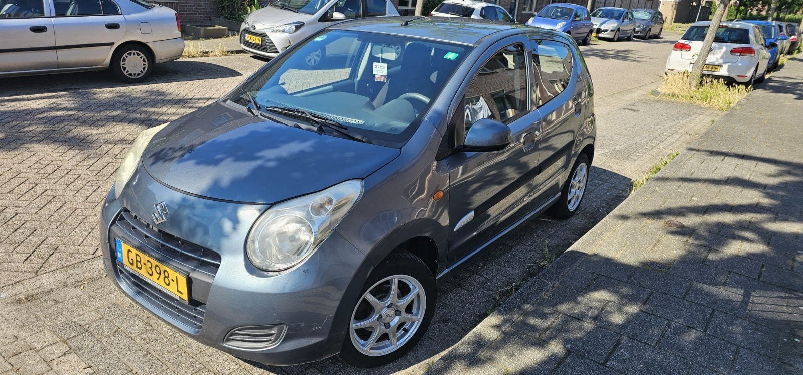 Suzuki Alto 1.0 2011 Grijs, Auto's, Suzuki, Voorwielaandrijving, 200 kg, 4 stoelen, Handgeschakeld