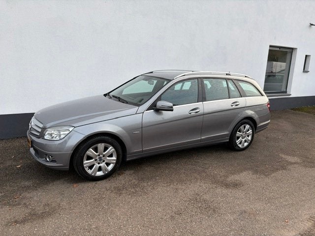 Mercedes-Benz C-klasse Estate 180 K BlueEFFICIENCY Business, Auto's, Achterwielaandrijving, Zwart, Origineel Nederlands, Verwarmde buitenspiegels