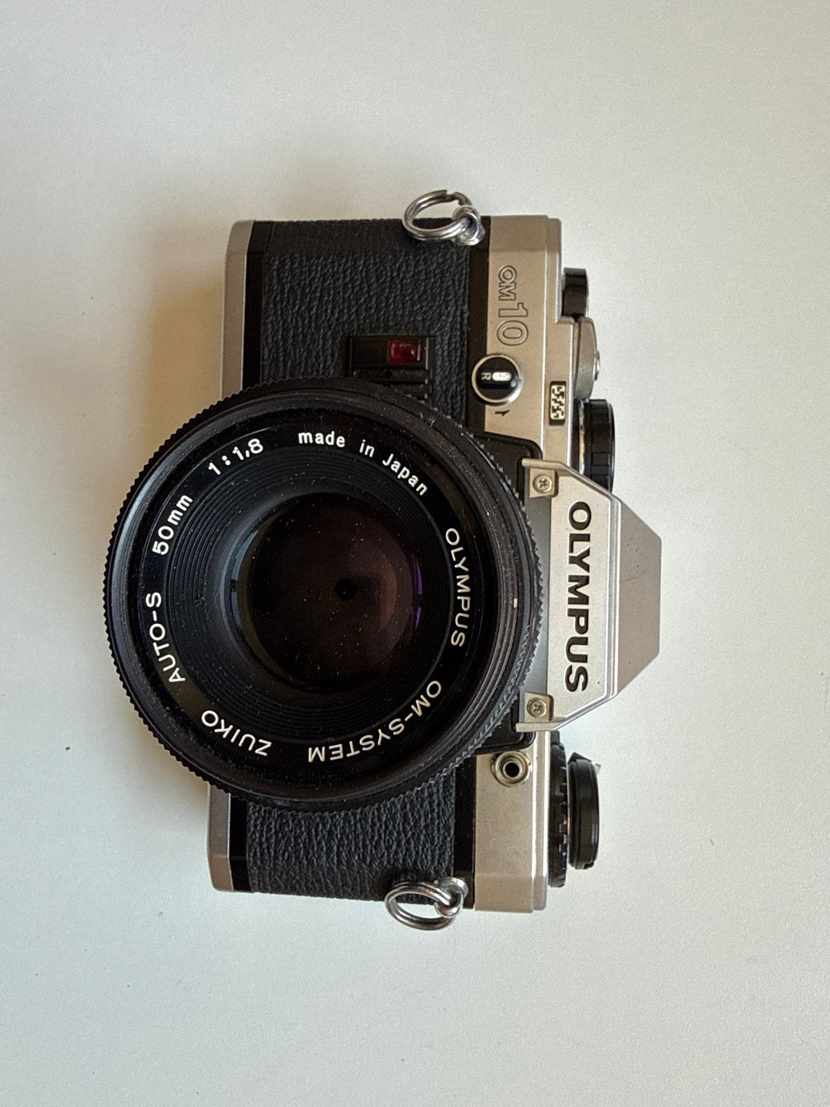 Olympus OM-10 Spiegelreflexcamera met Zuiko 50mm f/1.8 lens, Audio, Tv en Foto, Fotocamera's Analoog, Ophalen of Verzenden, Gebruikt
