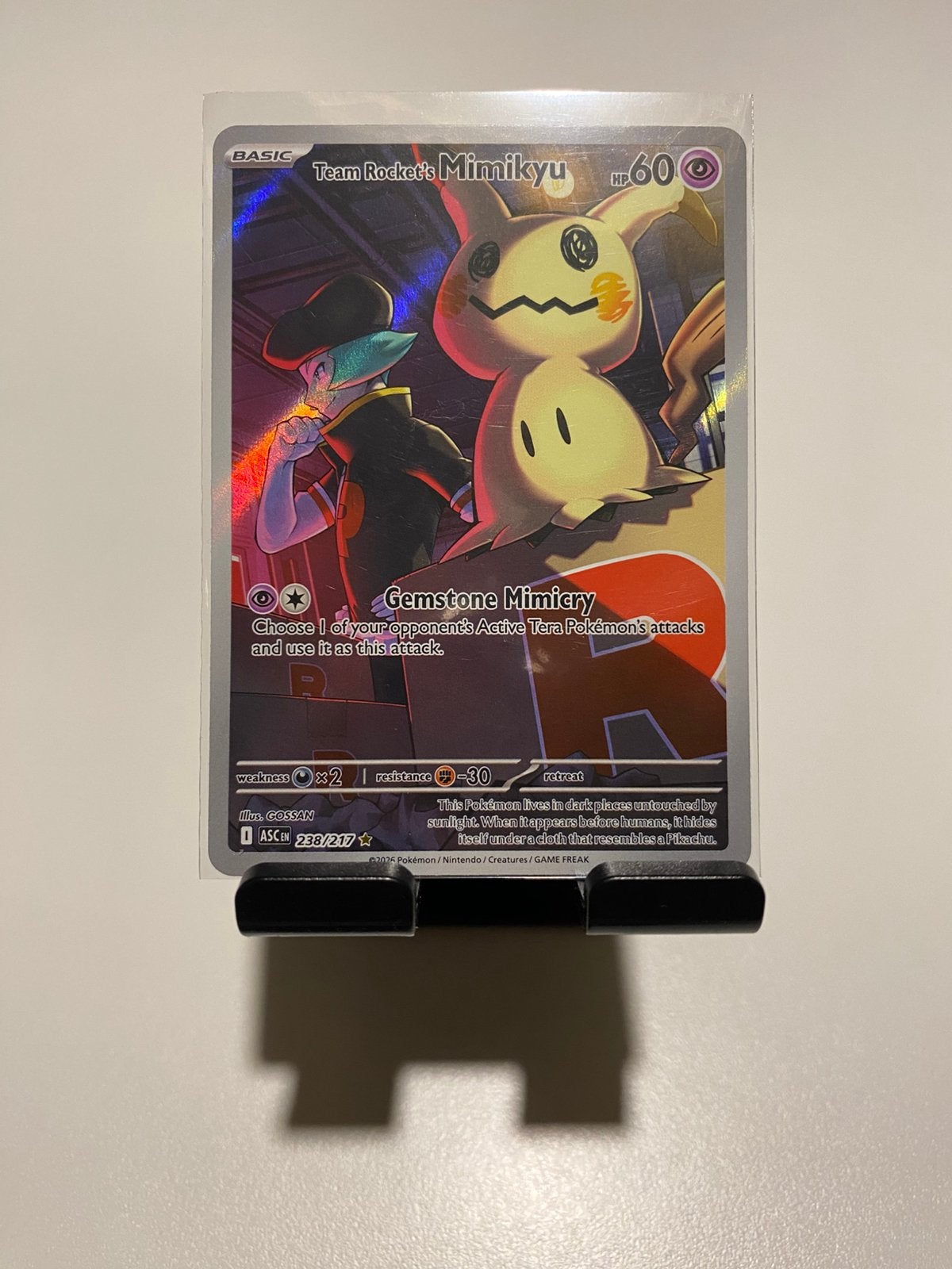 Team Rockets Mimikyu NM, Ophalen of Verzenden, Zo goed als nieuw