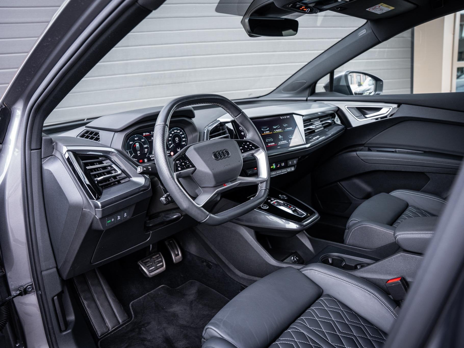 Audi Q4 Sportback e-tron 45 quattro Advanced edit. 77 kWh 3x, Auto's, Automaat, 494 km, Stof, Gebruikt