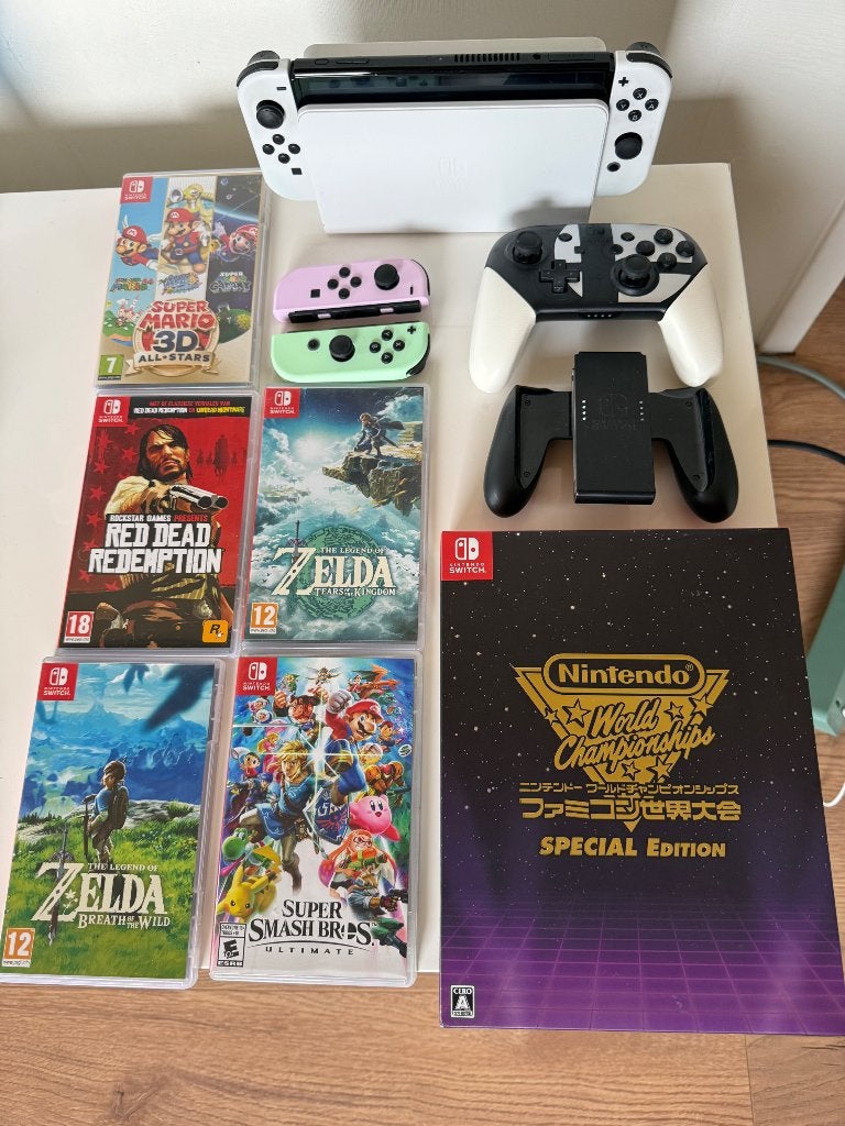 Nintendo Switch Oled compleet met verschillende games, Gebruikt, Switch OLED, Ophalen, Met 3 controllers of meer