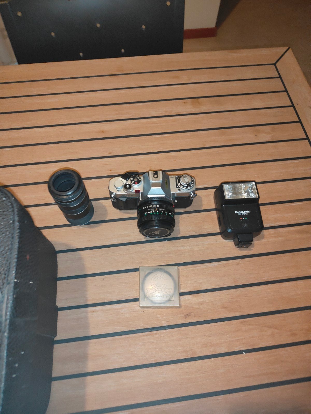 Canon AV-1 Spiegelreflexcamera met lens en flitser, Ophalen
