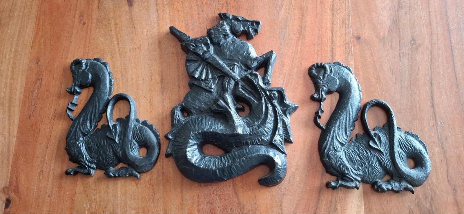 Wanddecoratie draken gietijzer, Ophalen